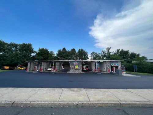 Professional paving crew working on a retail parking lot in Lehigh Valley, PA