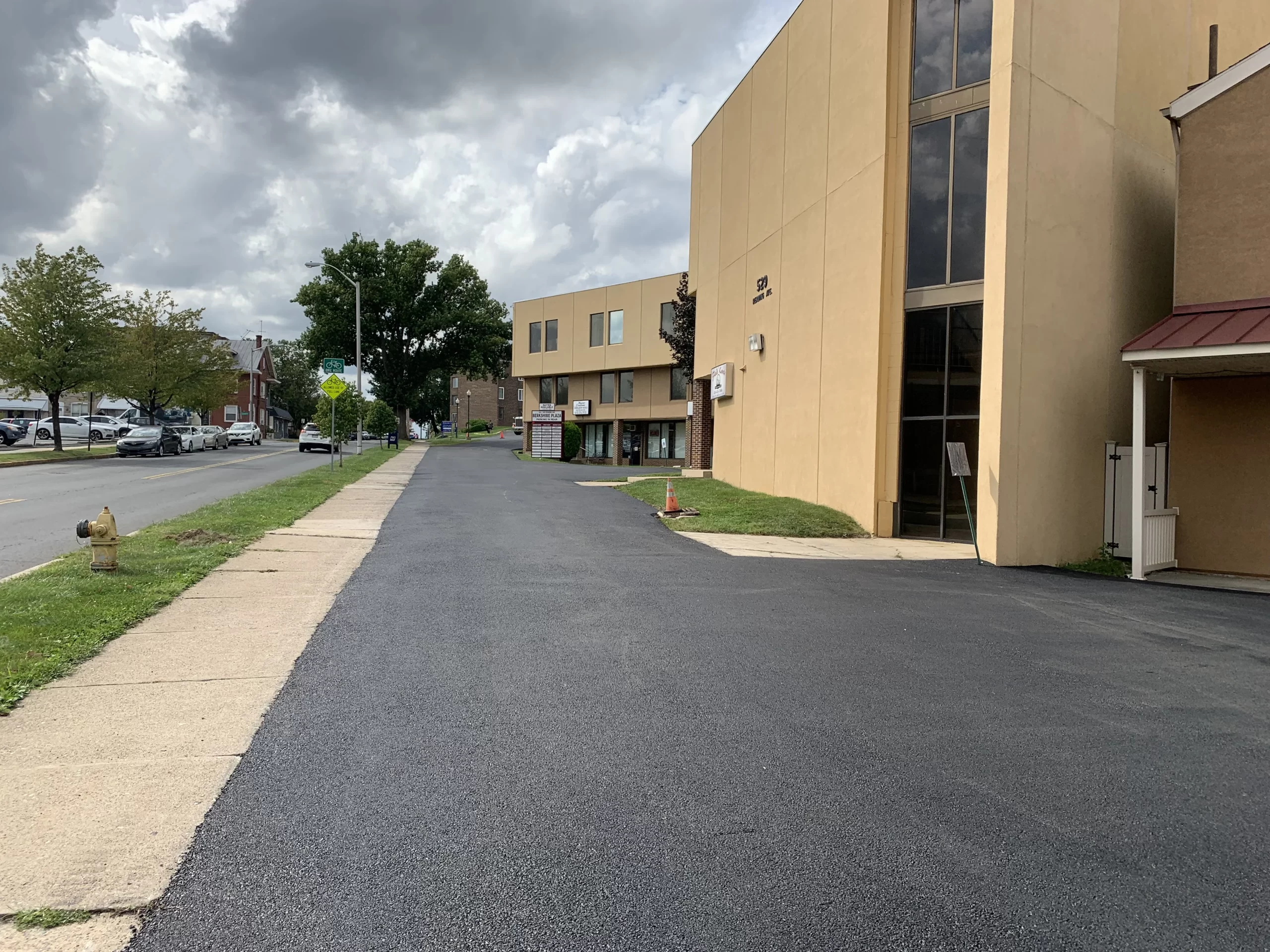 Expert paving contractor from a commercial paving company inspecting a parking lot for maintenance and repair needs.